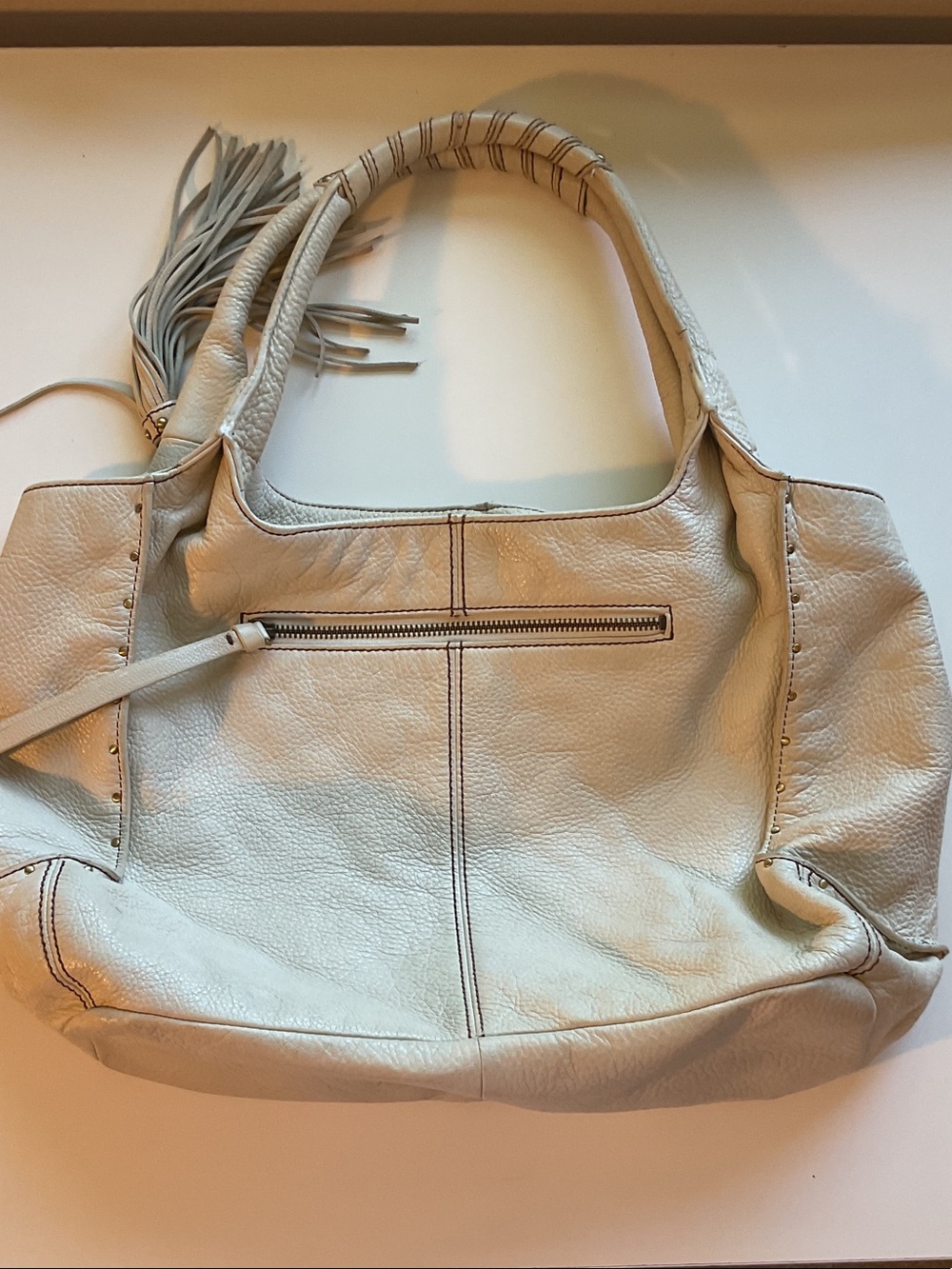 Perlina Cream Pebbled Leather Shoulder Bag with Tassel